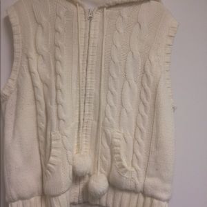 Cream colored “pom pom” sweater vest